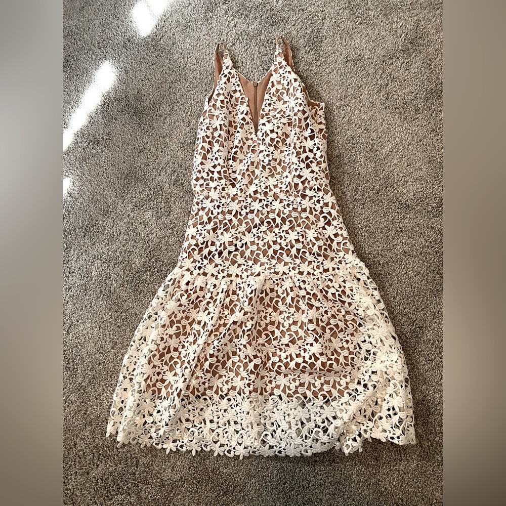 Dress the population size medium dress with white lace overlay.